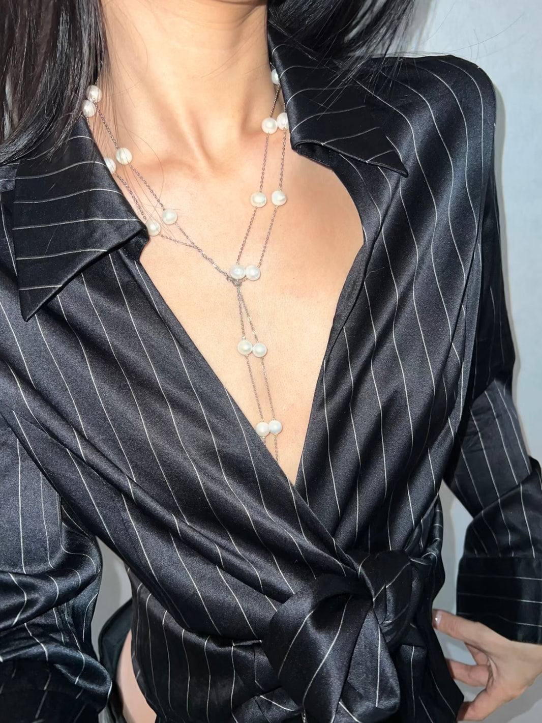 Convertible genuine freshwater pearl Y lariat drop necklace styled with silk shirt